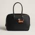 Cheval a Roulettes charm
